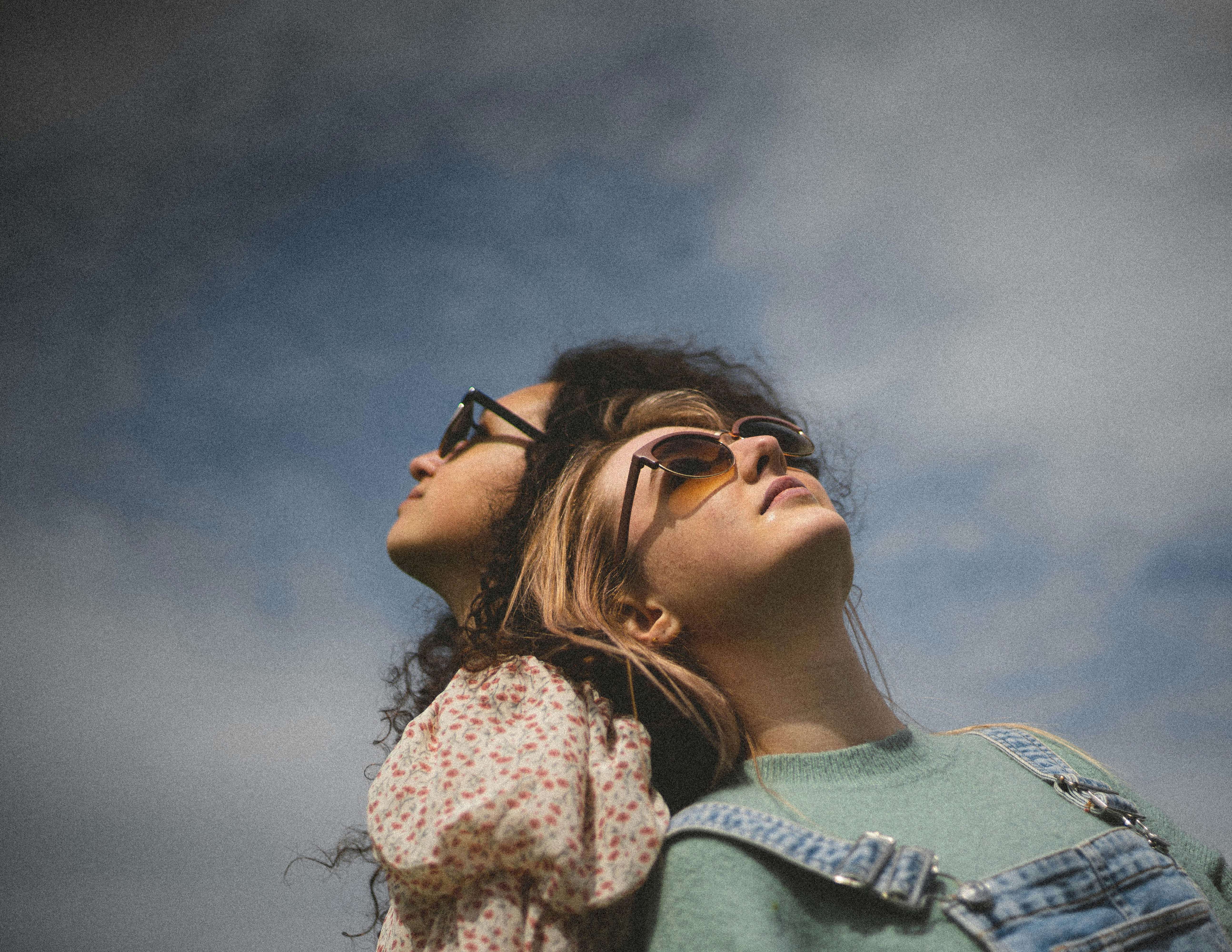 woman in black framed eyeglasses and blue denim jacket